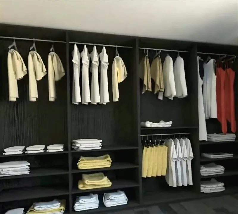 Walk-in wardrobe with open shelving by Yamout