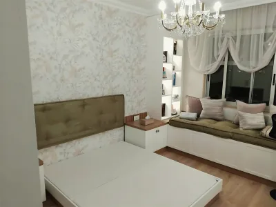 Bedroom with a window seat, cushions and curtains