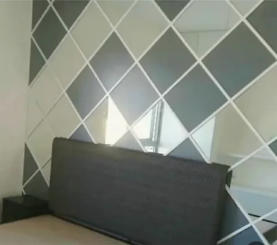 Bedroom wall painted in a diamond pattern, by Yamout