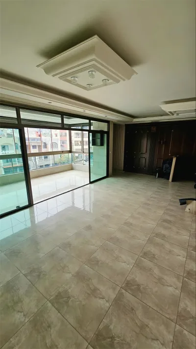 Large aluminum and glass sliding doors to a balcony