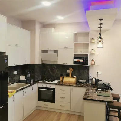 Fitted white kitchen by Yamout