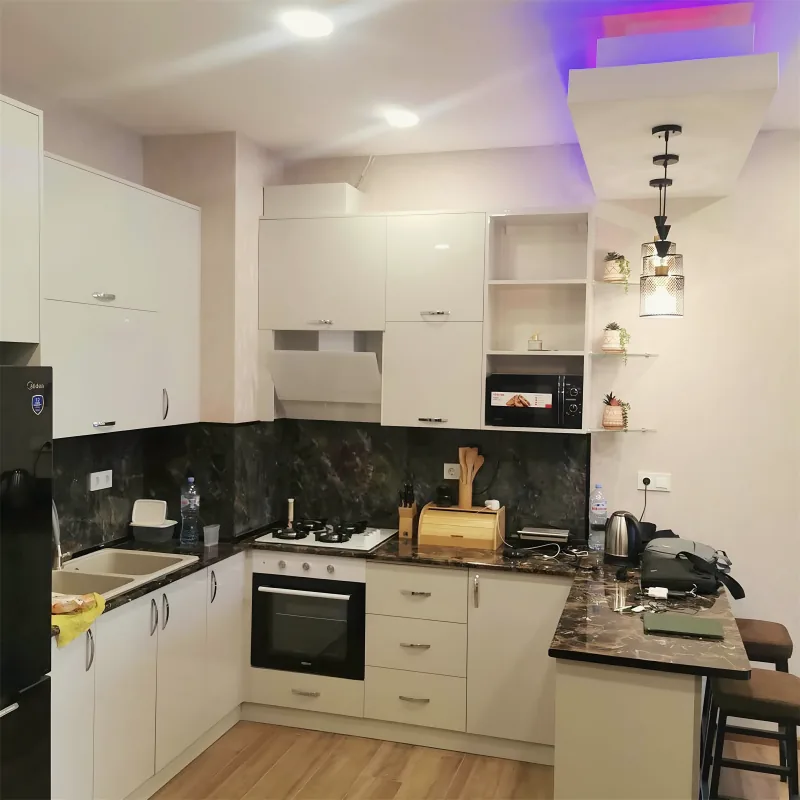 Fitted white kitchen by Yamout